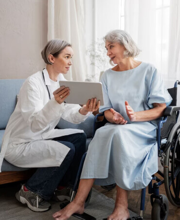 a nurse helping a senior lady with reports